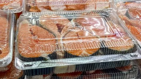 A tray of fish is displayed in a store Stock Photos