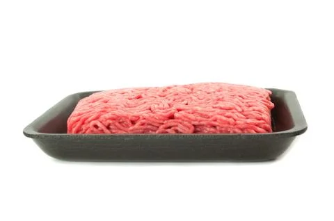 A tray of fresh lean ground beef from supermarket isolated on white backgroun Stock Photos