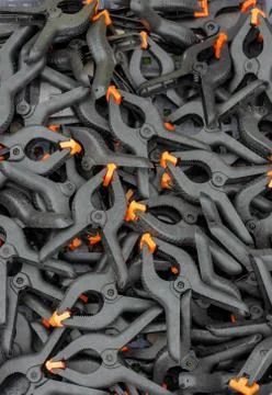 A tray full of spring clamps Stock Photos