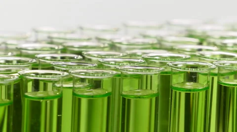 Tray full of test tubes filled with green liquid Video stock 64290729