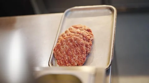 A tray of meat is on a counter Video stock 296055904