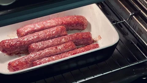 A tray of meat is in an oven 스톡 동영상 275326279