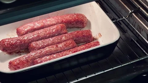 A tray of meat is in an oven 스톡 동영상 276309920