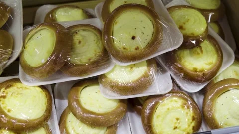 Tray-packed buns with cottage cheese and a brown outer ring, ready for sale Stock Footage 327538464