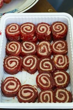 Tray of Rolled Meat with Spiral Pattern Fotos de archivo