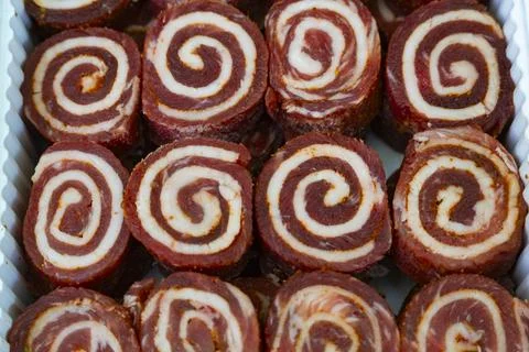 Tray of Rolled Meat with Spiral Pattern Stock Photos