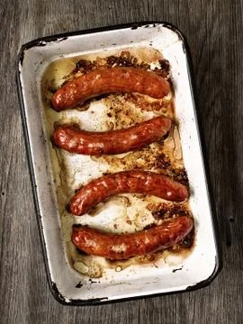 Tray of rustic roasted sausages Stock Photos