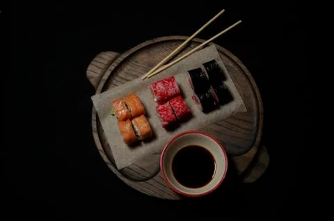 Tray with sushi on black background Stock Photos
