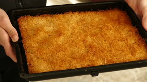 A Tray of Thin Kadayif Dessert, Fried Kadayif Dessert from Turkish Desserts, Stock Footage 238701449