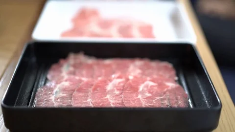 Tray of thin sliced beef for suki or shabu Stock Footage 109325967
