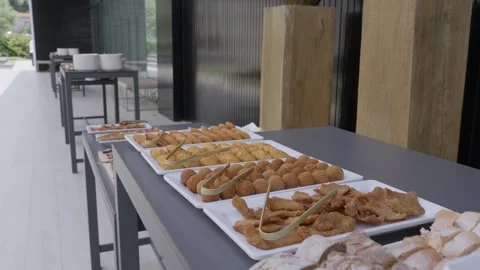 Trays Of Fried Savoury Snacks On A Long Buffet Table At A Venue 動画素材 342724804
