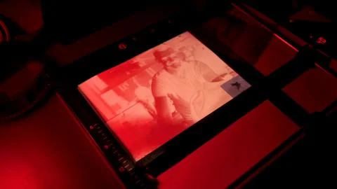 Trays reagents in darkroom. Process developing photos. Photographic enlargers Stock Photos
