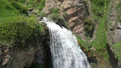 Trchkan waterfall cascading over rocky cliffs into a canyon, Armenia Stock Footage 342432592