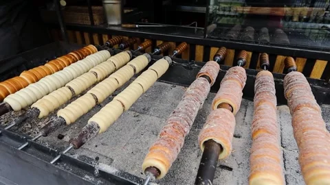 Trdlo typical Czech pastries are roasted on fire at a street market in Prague Stock Footage 276126219