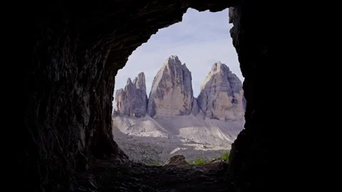 Tre Cime di Lavaredo framed by the Grotta delle Tre Cime cave Stock Footage 346287841