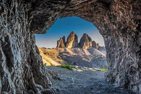 Tre Cime di Lavaredo view from cave at sunset, Dolomites Stock Photos