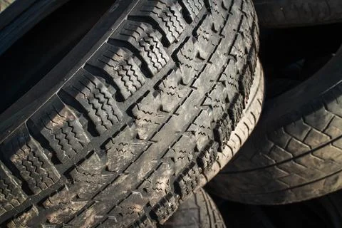 Tread of an old tire close-up. Stock Photos