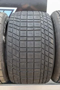 Tread pattern on large rubber speedway tyres in the pit area before a race 写真素材