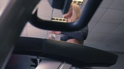 Treadmill, cardio training, she is engaged in sports shoes on a simulator in the Stock-Footage 74133761