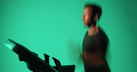 Treadmill, running and man with exercise in studio, speed training and endurance Vidéo 330990119