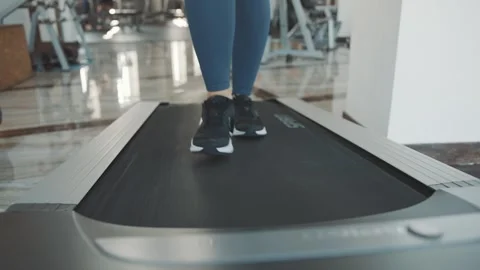 Treadmill workout session featuring a woman in a gym Stock Footage 313326934