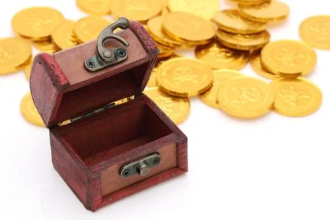 Treasure chest with gold colored coins Stock Photos