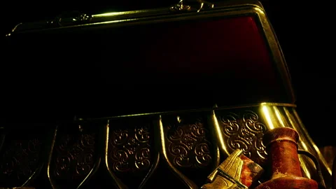 Treasure chest with open lid and small objects placed nearby Stock Footage 344057972