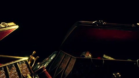 Treasure chest opened with various items inside during evening time Stock Footage 340016281