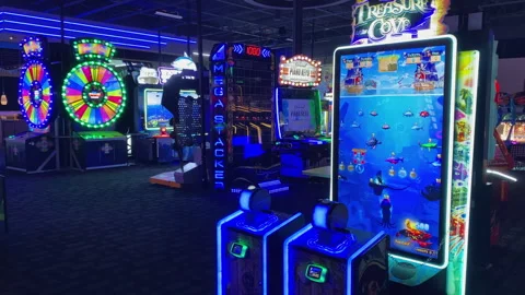 Treasure Cove arcade machine screen with pirate map game in a neon-lit D Dave-25 Stock Footage 339533361