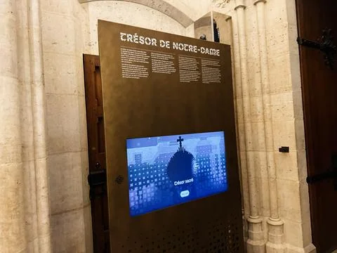 Treasure exhibit panel inside Notre Dame cathedral interior in Paris, Franc.. Stock Photos
