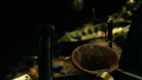 Treasure found in dark cave with old pots and shiny coins Stock Footage 339462357