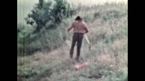 Treasure hunter guarding steps while looking at treasure map on field Stock Footage 280137031