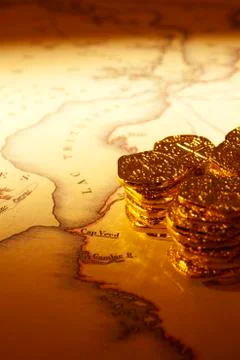 Treasure map and doubloons Stock Photos