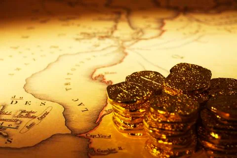 Treasure map and doubloons Stock Photos