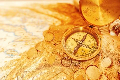Treasure map with compass and gold coins Stock Photos
