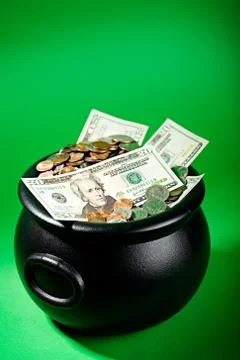 Treasure: Money Pot On Green Background Stock Photos