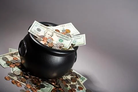 Treasure: Pot Overflowing with US Currency Stock Photos