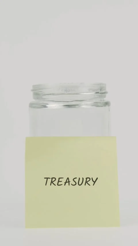 Treasury text or word on yellow sticky note attached to glass jar with hand Stock Footage 311798632