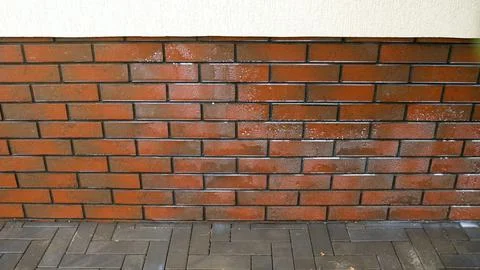 Treatment of the facade of a building with a protective solution. Water rep.. Stock Photos