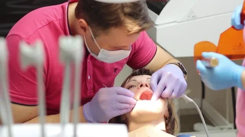 Treatment of the patient's teeth using a paint lamp, UV light Stock Footage 72370780