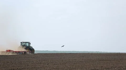Treatment of soil by using a plow and tractor Stock Footage 67168679