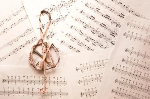 Treble clef on music sheets background with notes Stock Photos