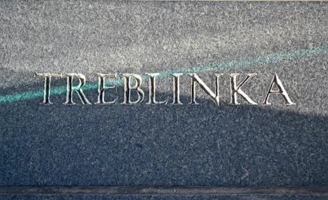 Treblinka text closeup on stone wall Stock Photos