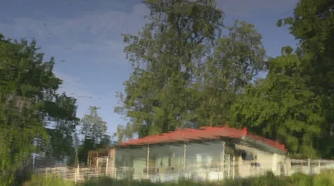 Tree and house reflections in a lake Stock Footage 28833218