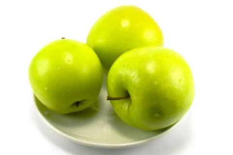 Tree apples on a plate Foto stock