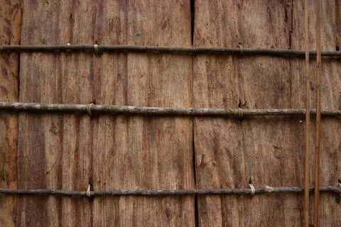 Tree bark texture made into a simple house wall Stock Photos