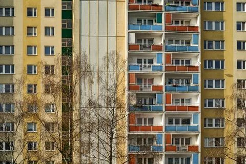 Tree branches in front of the facade with balconies Stock Photos
