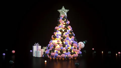 A tree of Christmas balls is growing dynamically on black background. Stock Footage 203292157