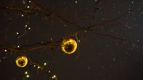 Tree with Christmas decorations on the background of falling snow Stock Footage 103339672