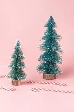 Tree Christmas tree with candy cane on pastel pink studio background.Holiday  Stock Photos